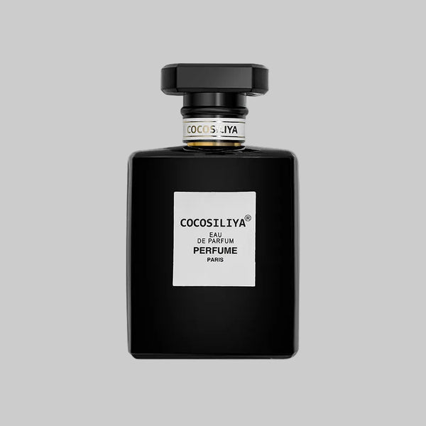 Black perfume bottle with white label on a white background